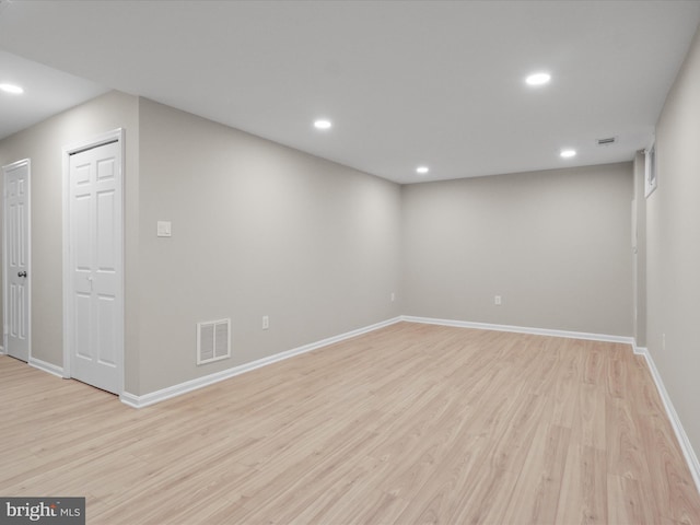 basement featuring light wood-type flooring