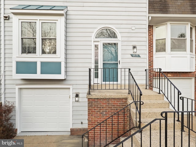 entrance to property featuring a garage