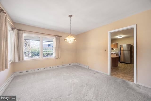 empty room featuring an inviting chandelier and carpet flooring