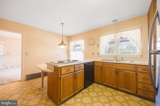 kitchen featuring sink, hanging light fixtures, a baseboard radiator, dishwasher, and kitchen peninsula