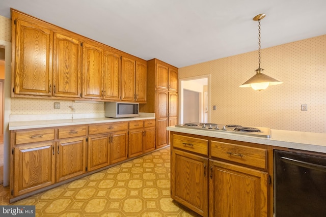 kitchen with gas stovetop and decorative light fixtures