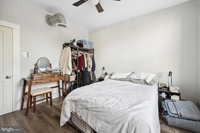 bedroom featuring ceiling fan and dark hardwood / wood-style flooring