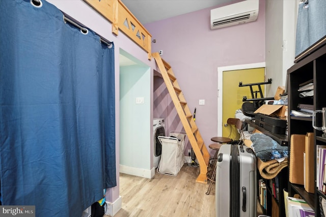 interior space with washer / dryer and a wall unit AC