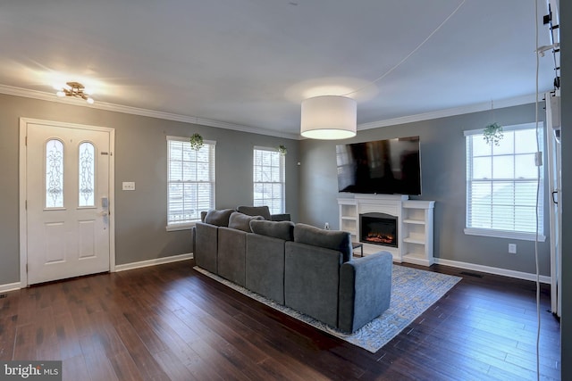 living room featuring crown molding, dark hardwood / wood-style flooring, and a wealth of natural light