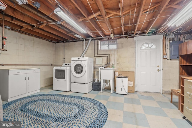 washroom with separate washer and dryer, sink, and electric panel