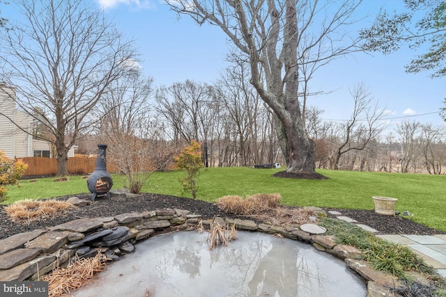 view of yard with a fire pit