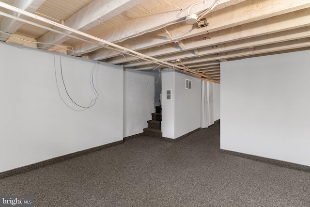 basement with dark carpet