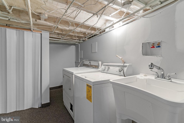 laundry area featuring sink and independent washer and dryer