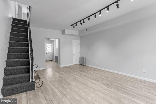 unfurnished living room featuring light wood-type flooring