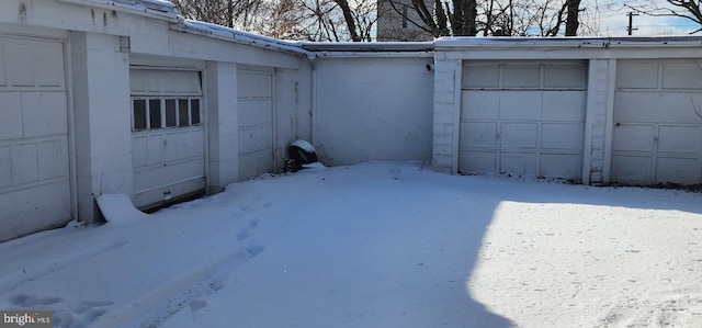 view of snow covered garage