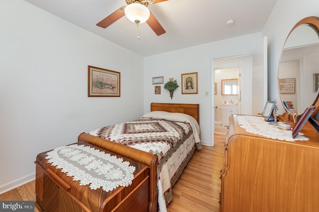 bedroom with ceiling fan, sink, and light hardwood / wood-style floors