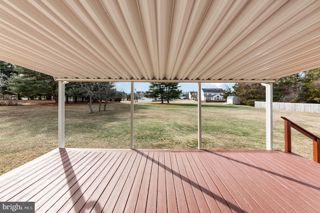 wooden terrace with a yard