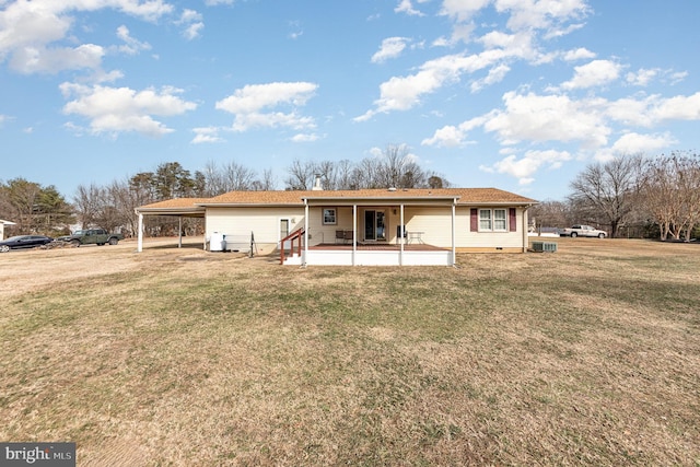 rear view of house with a yard