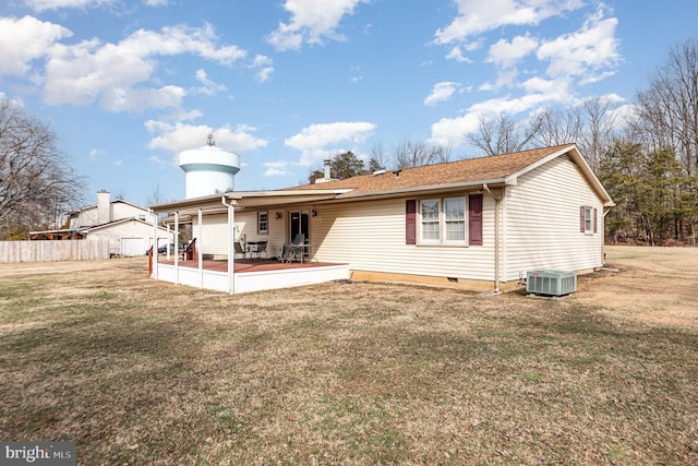 rear view of house with a patio area and a lawn