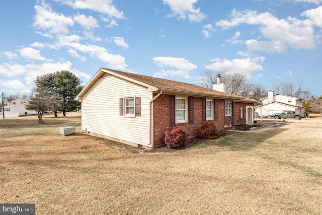 view of home's exterior featuring a yard