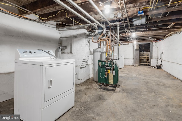 basement featuring washer / clothes dryer and water heater