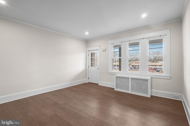 interior space featuring ornamental molding and dark hardwood / wood-style floors