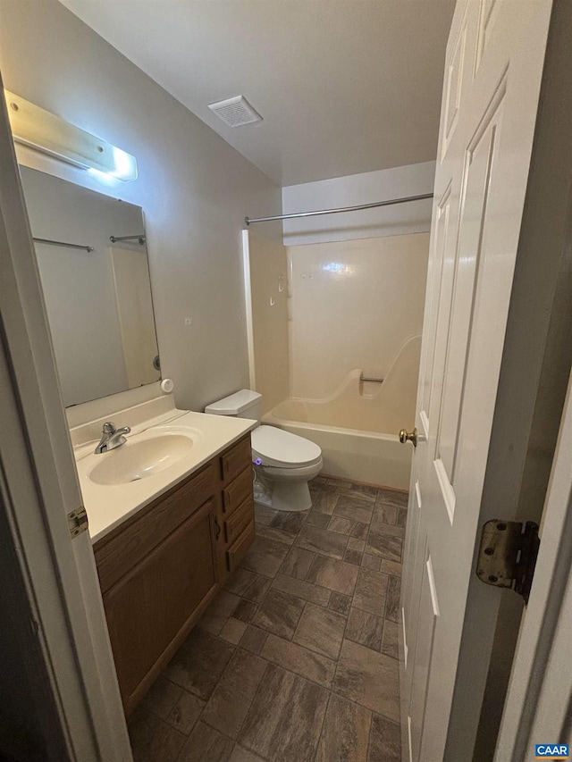 full bathroom featuring shower / tub combination, vanity, and toilet