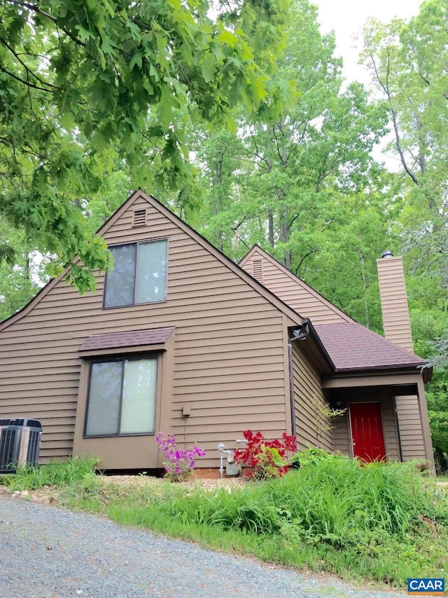 view of side of property with cooling unit