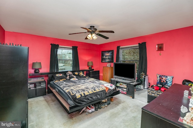 carpeted bedroom with ceiling fan