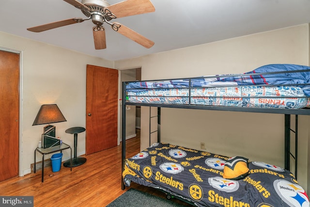 bedroom featuring hardwood / wood-style floors and ceiling fan