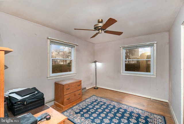 sitting room featuring ceiling fan and light wood-type flooring