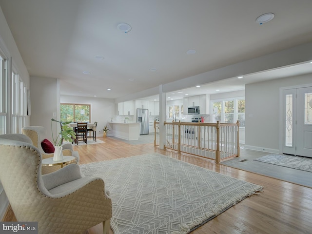 living room with light hardwood / wood-style flooring