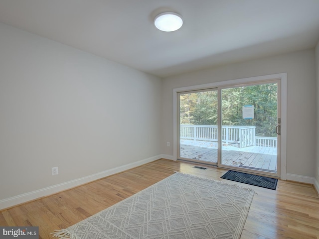 doorway to outside with light hardwood / wood-style floors