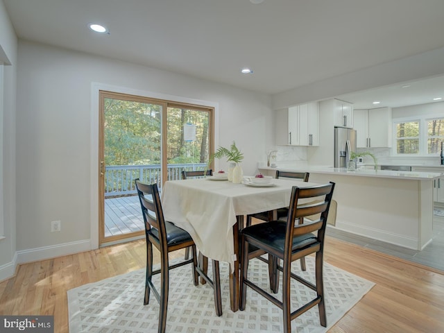 dining area featuring light wood-type flooring