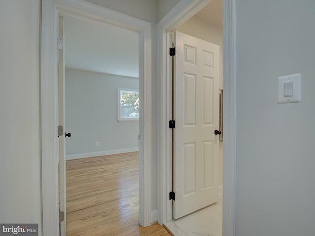 corridor featuring light hardwood / wood-style floors