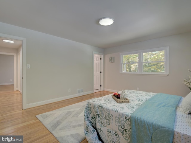 bedroom with light hardwood / wood-style flooring