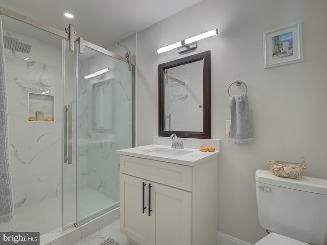 bathroom featuring vanity, toilet, and an enclosed shower