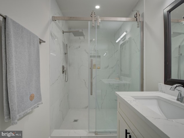 bathroom with vanity and an enclosed shower