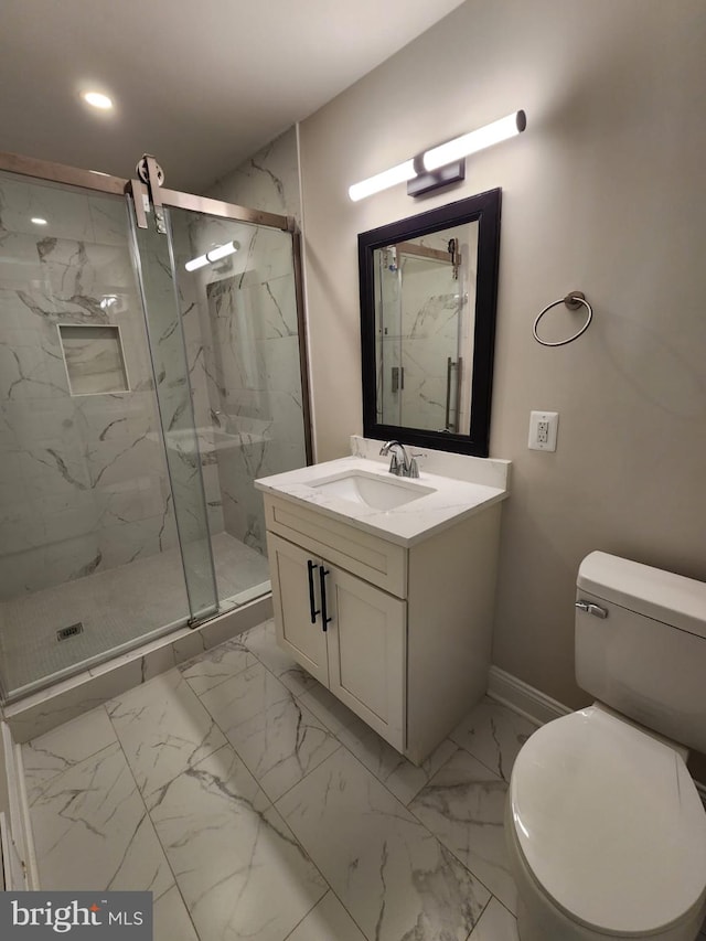 bathroom with vanity, an enclosed shower, and toilet