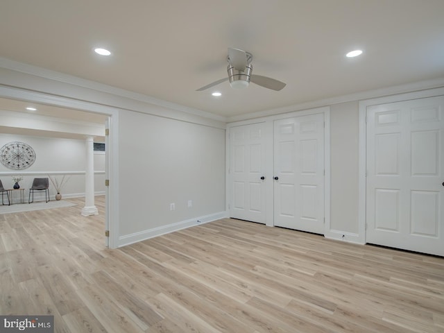 unfurnished bedroom featuring light hardwood / wood-style flooring, ornamental molding, ceiling fan, and ornate columns