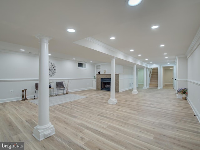 basement featuring crown molding and light wood-type flooring