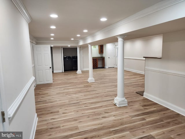 basement with ornamental molding and light wood-type flooring