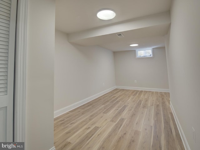 basement featuring light wood-type flooring