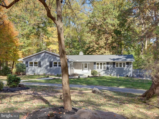 ranch-style house with a front lawn