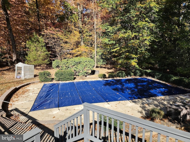 view of swimming pool featuring a patio