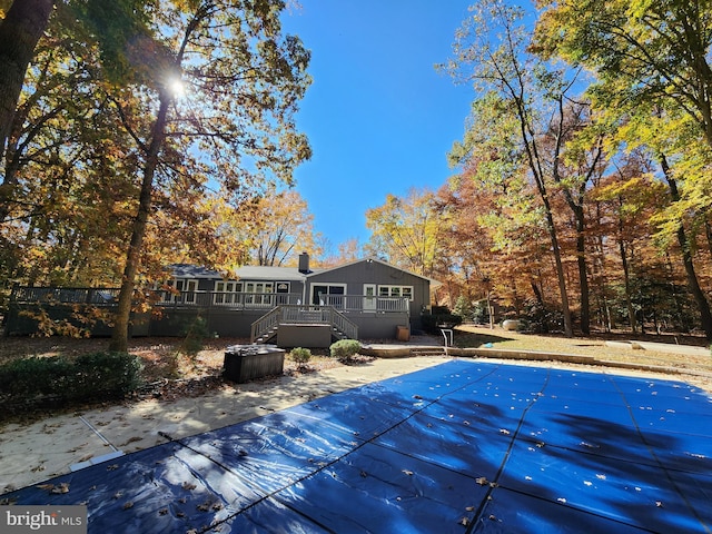 view of pool with a wooden deck