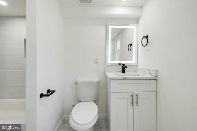 bathroom featuring vanity and toilet