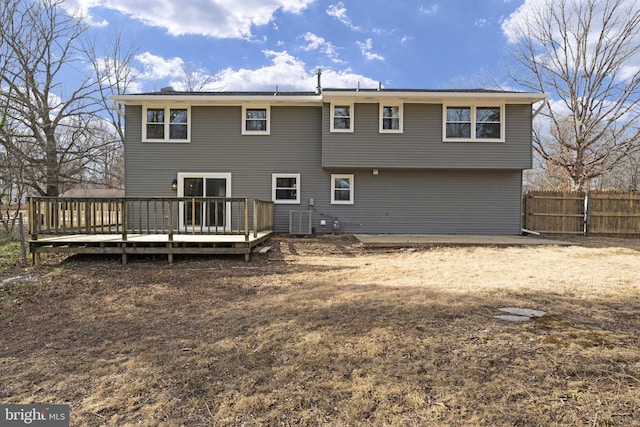 back of property featuring a wooden deck