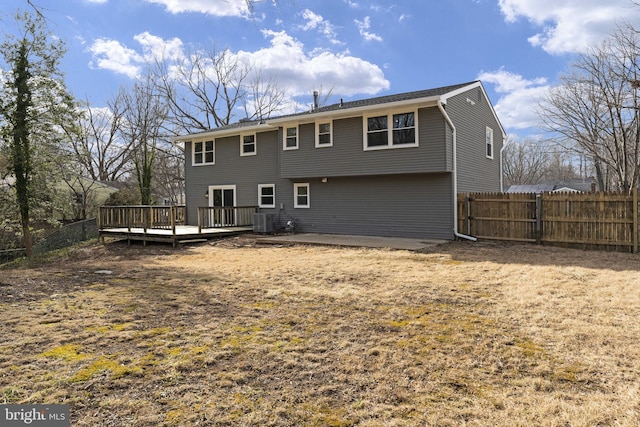 back of house featuring a wooden deck