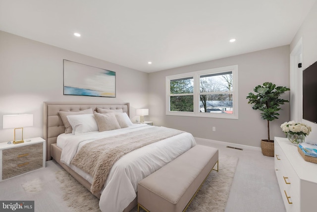 bedroom with light colored carpet