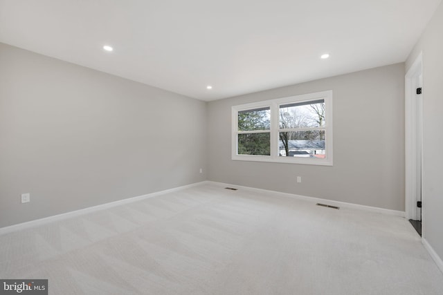 empty room with light colored carpet