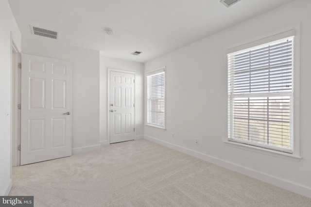 unfurnished bedroom with light carpet