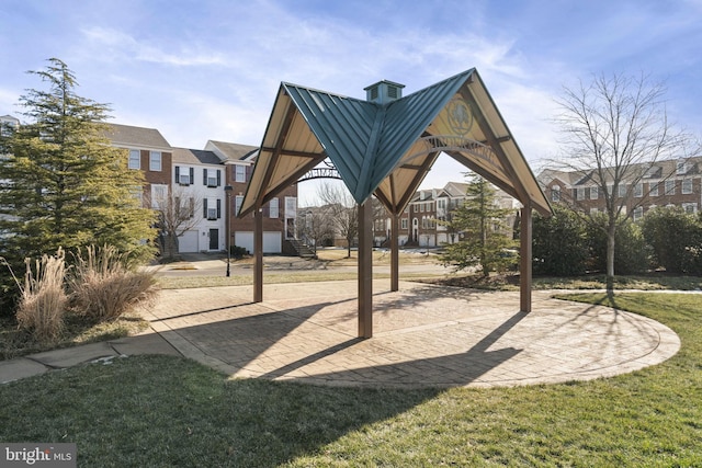 view of home's community featuring a lawn