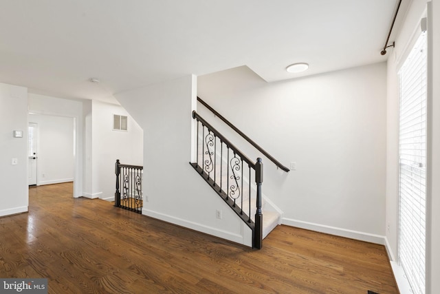 staircase featuring hardwood / wood-style floors