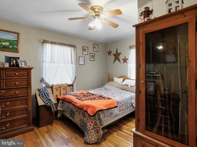 bedroom featuring ceiling fan and light wood-type flooring